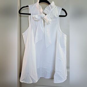 Adorable White Sleeveless Top With Bow Tie In Back
